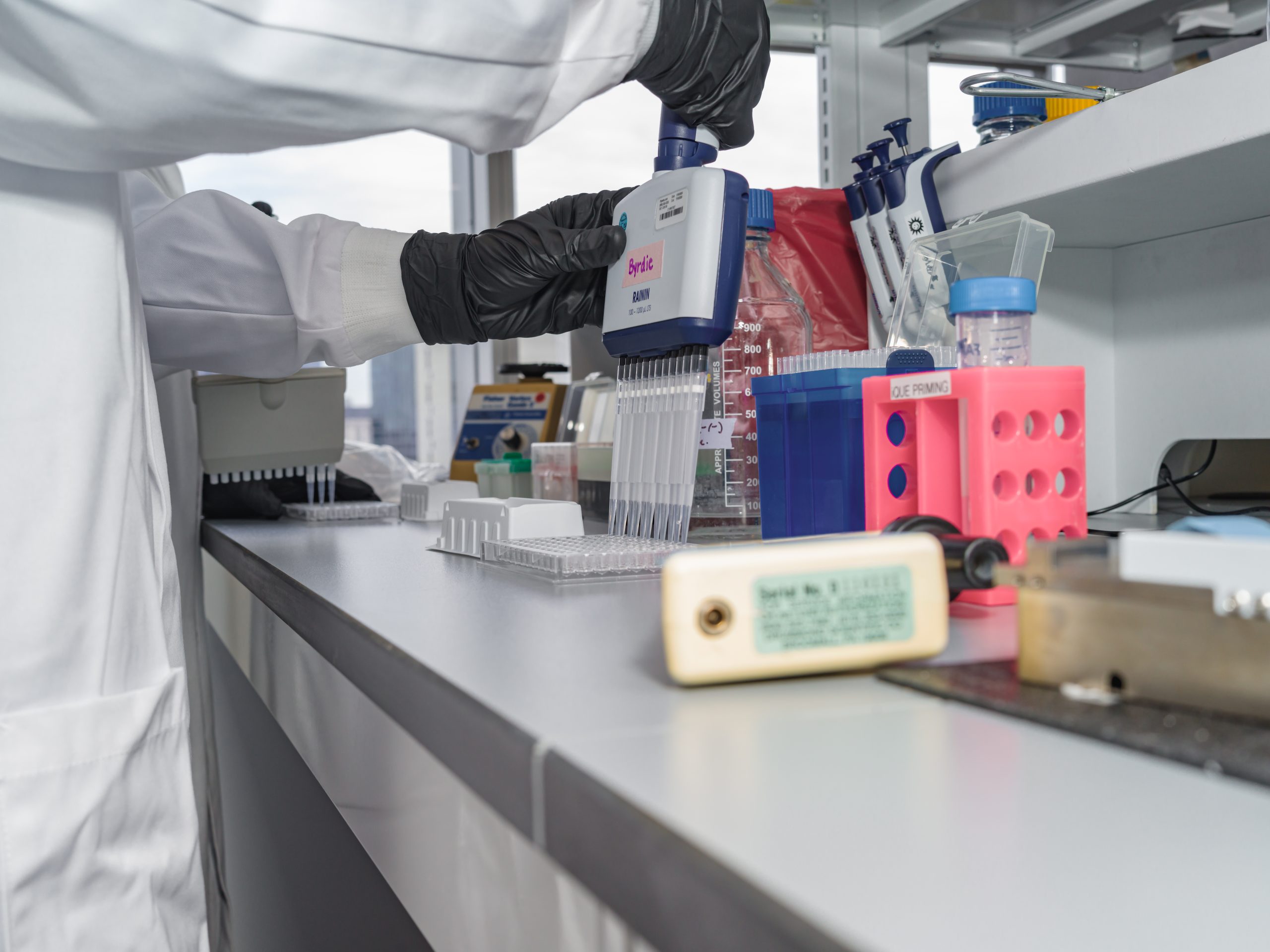 Integral Molecular scientist works with a pippette