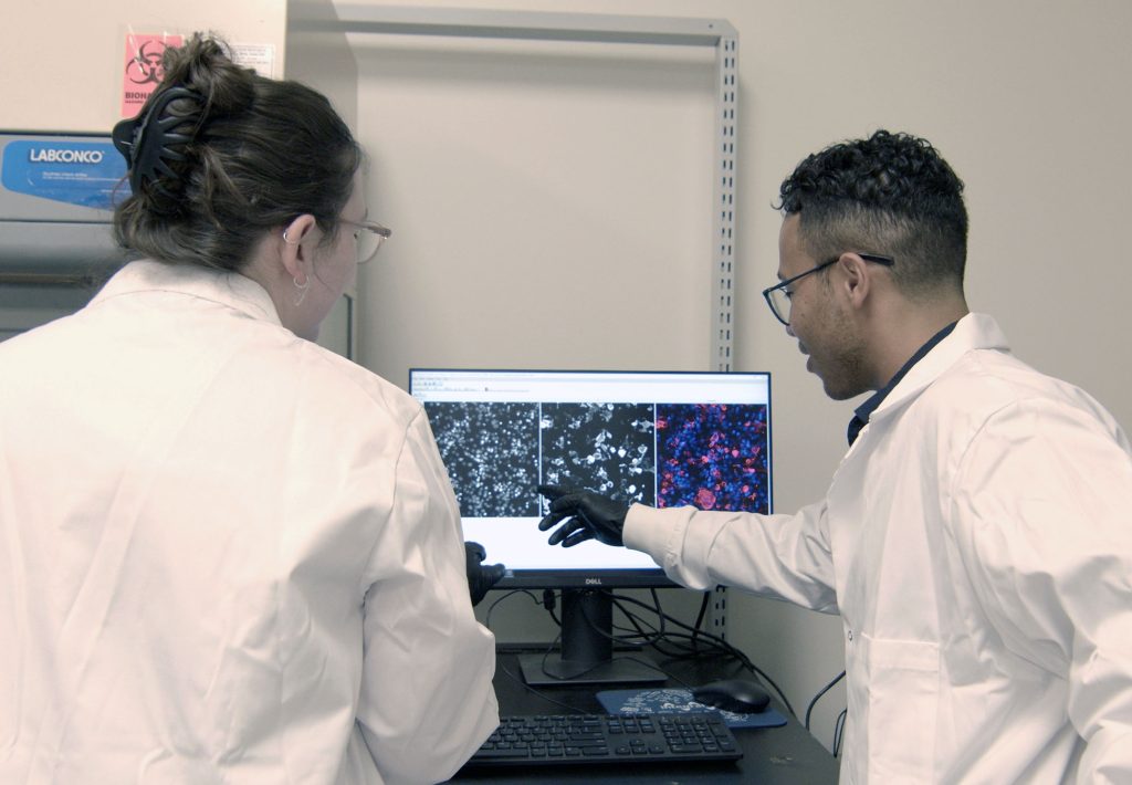 MPA team members reviewing cell staining.